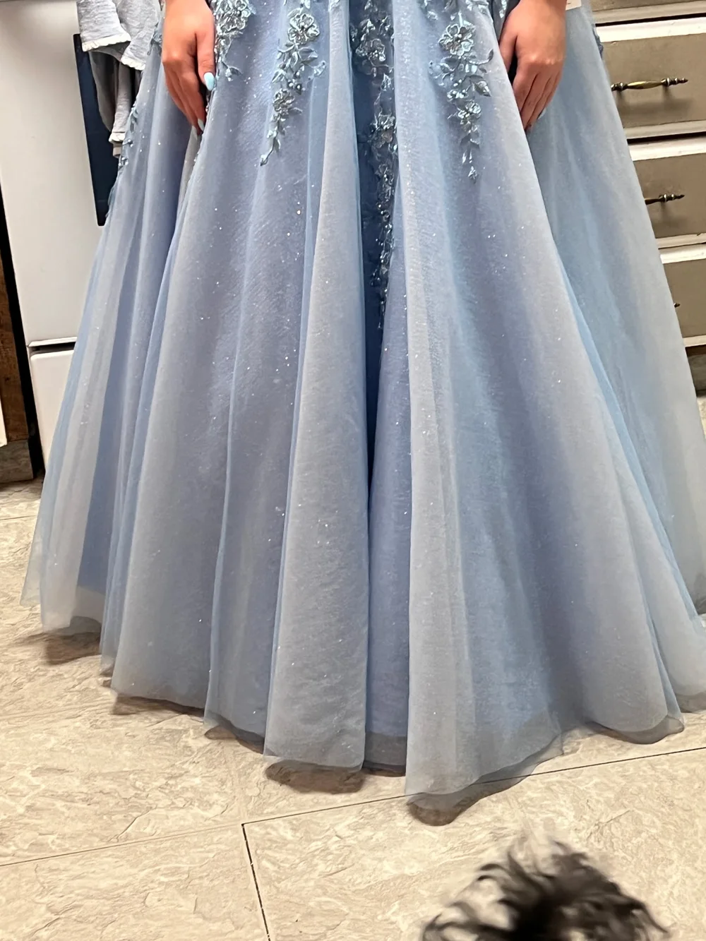 A beautifully detailed pale blue gown hemmed by Dallas Sewing and Alteration