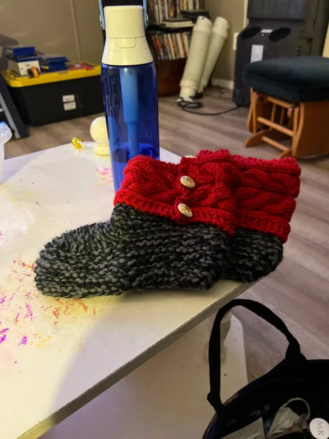 Red and grey hand-knitted boot-style slippers