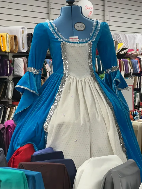 Blue and cream princess costume with decorative sleeves